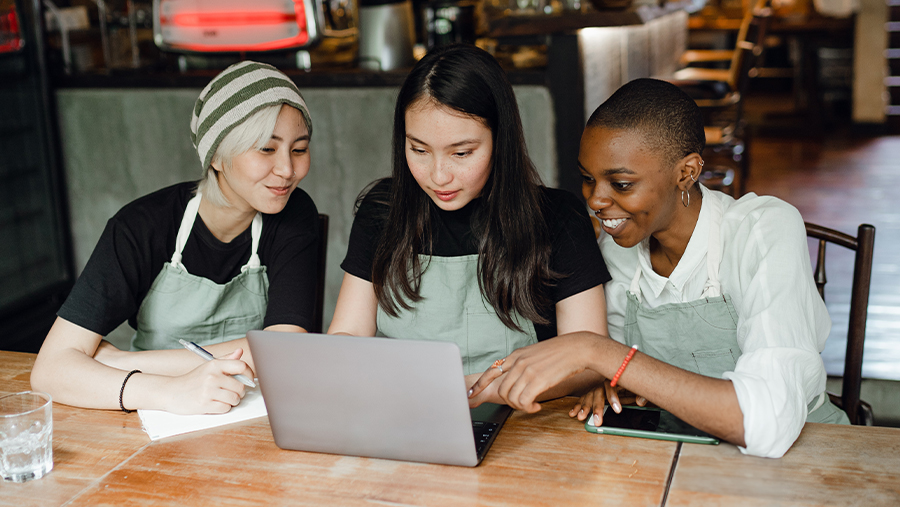 Cafe Employees Using Laptop to Open an Account