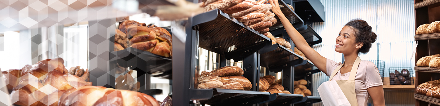 Bakery Employee Selecting Bread