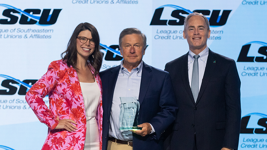 CEO and President Lin Hodges with LSCU Award and Officials