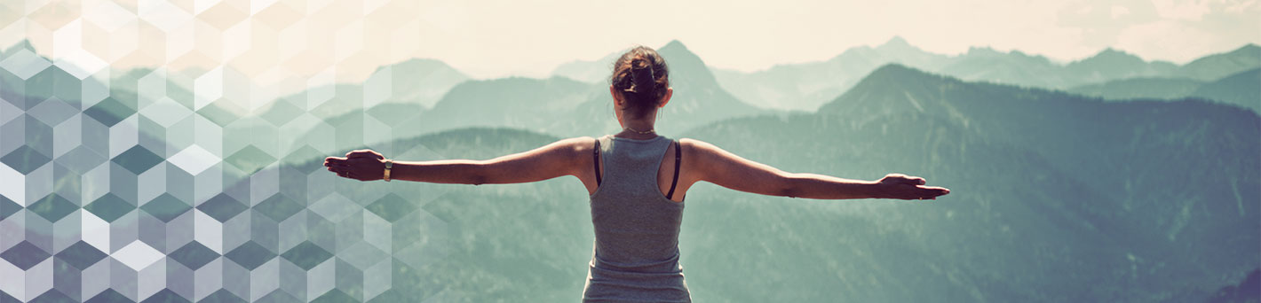 Woman outdoors looking at mountains.