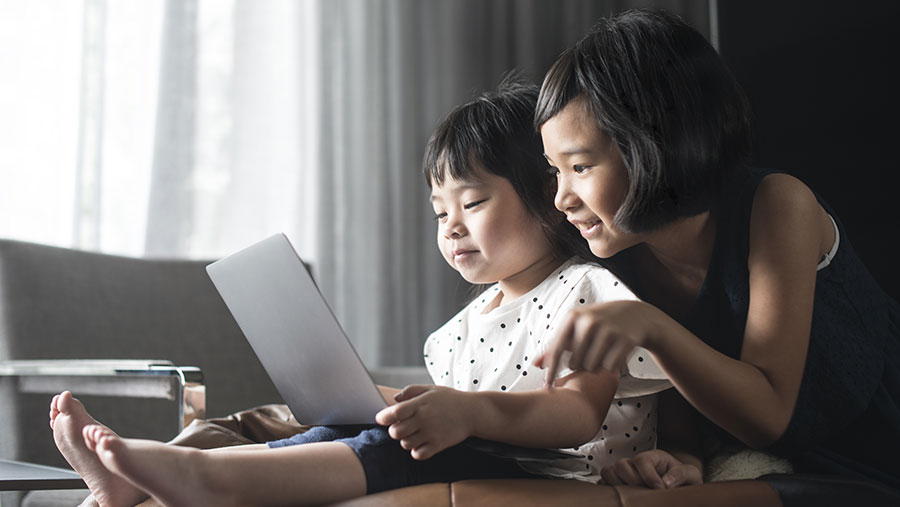 Mother and daughter using a laptop