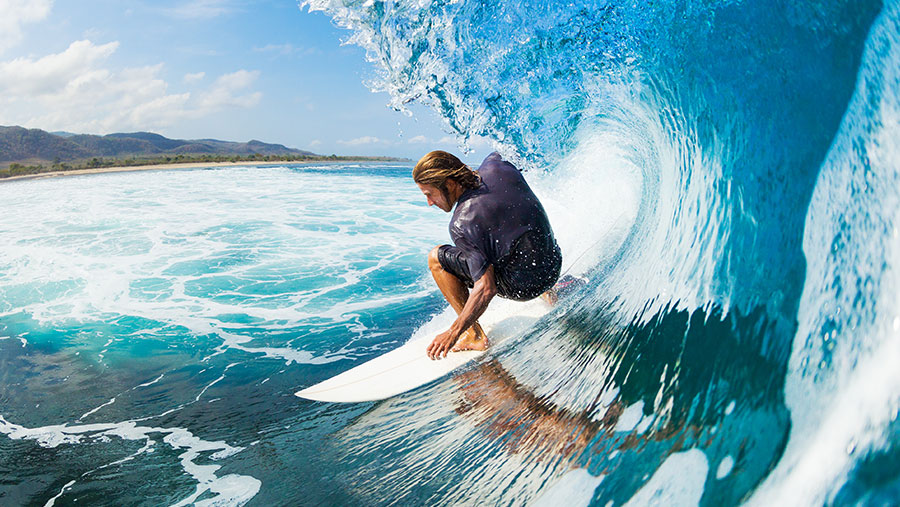 Surfer catching a wave