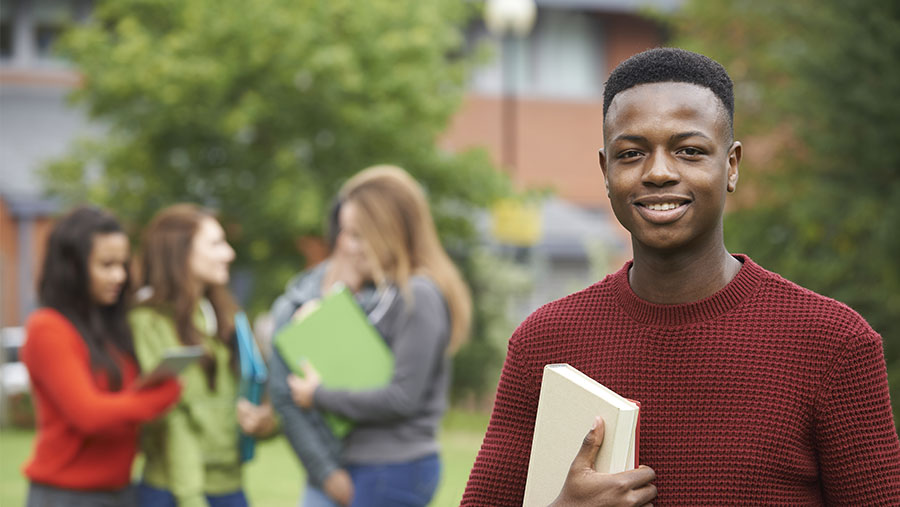 Student holding textbook