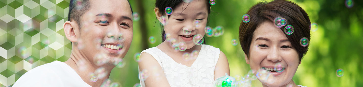 Family blowing bubbles.