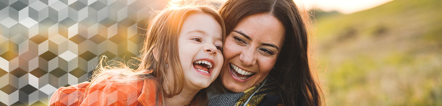 Mother and daughter outside.