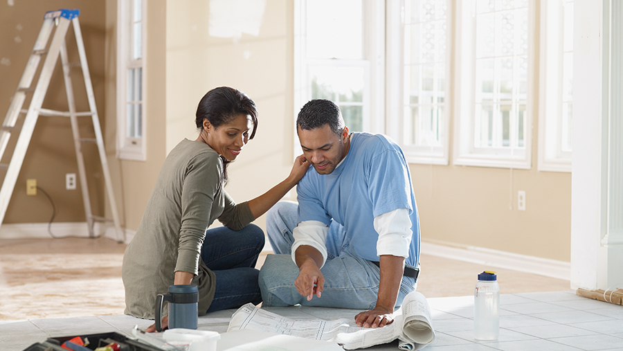 Couple looking at house blueprints