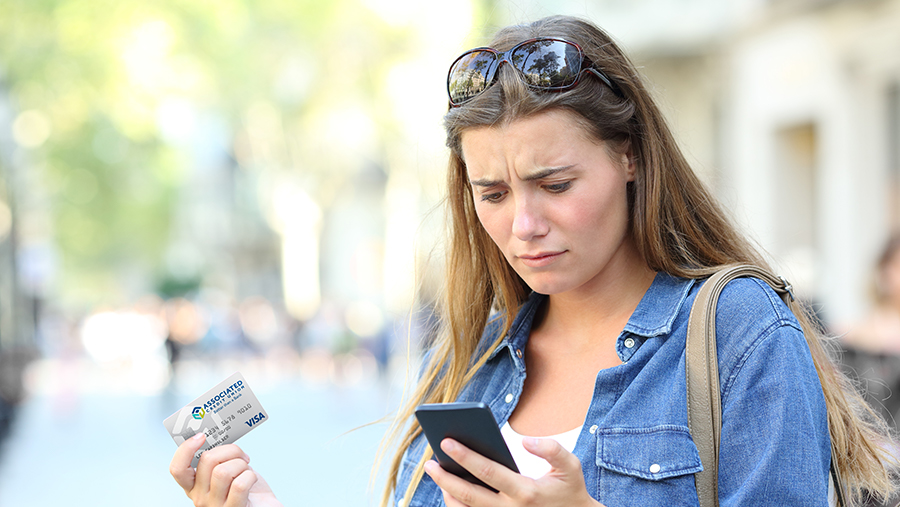 Woman confused looking at phone