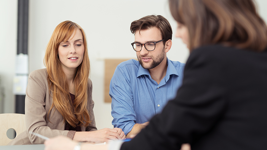 Couple looking at papers, getting advice