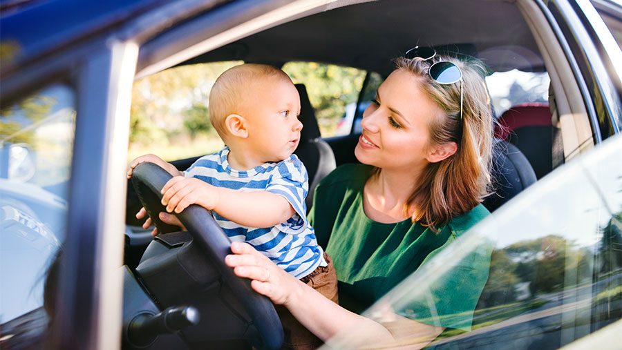 Woman drinking coffee in car