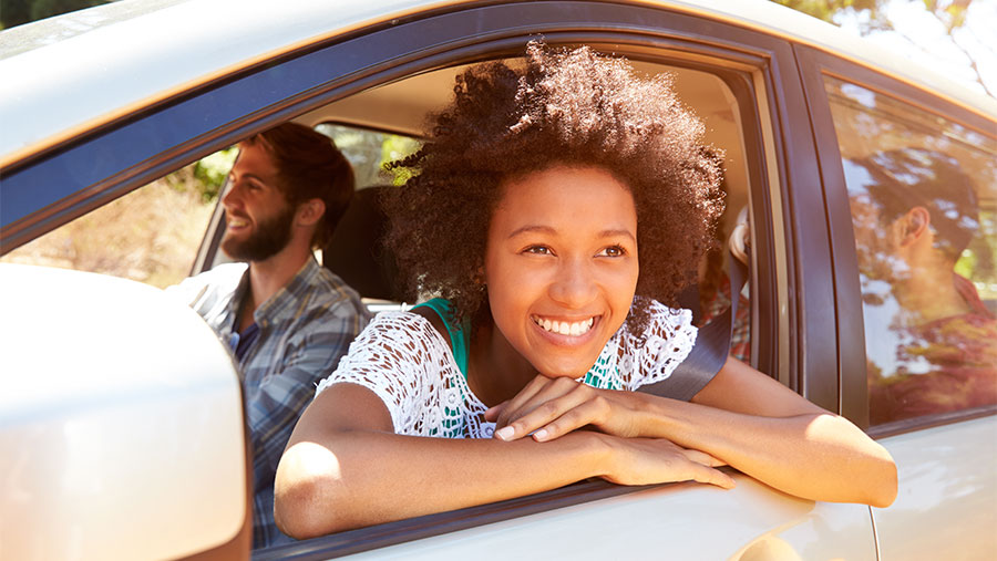 Woman and friends in car