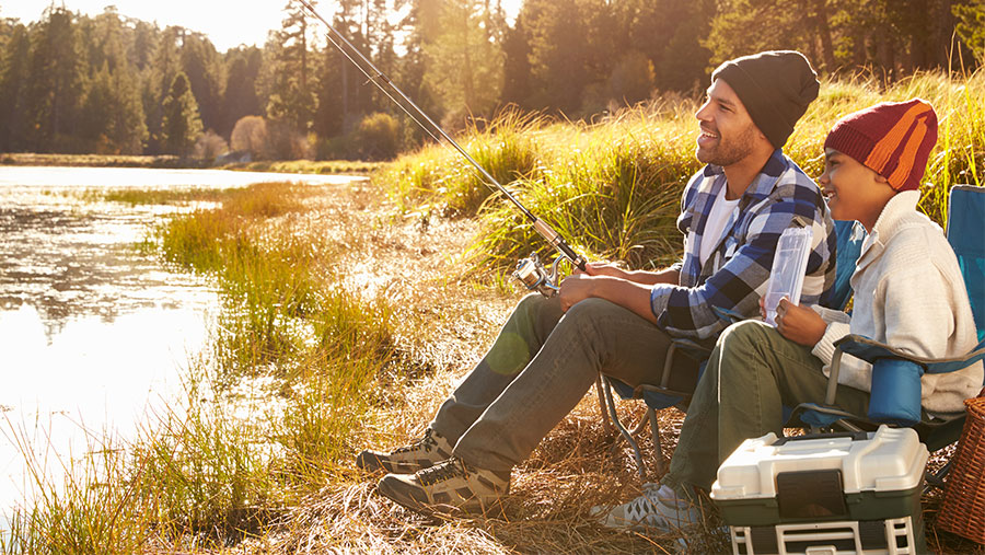 Father and child fishing together