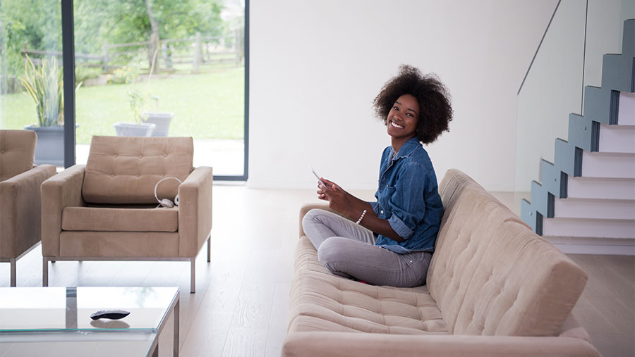 Woman on the couch smiling