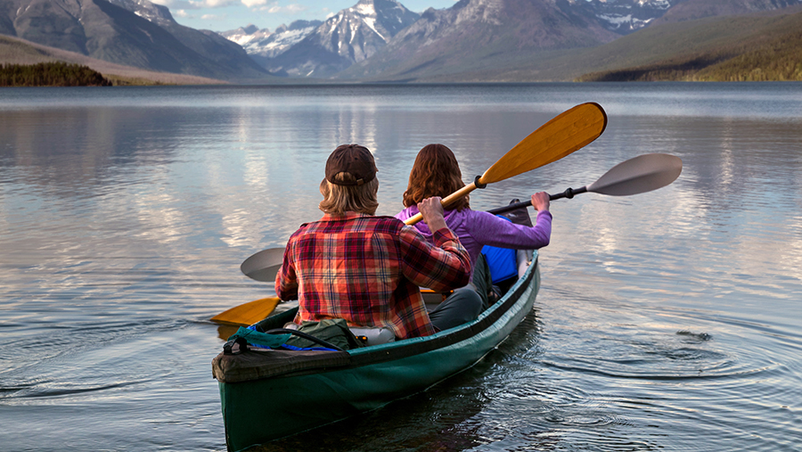 Couple kayaking in lake