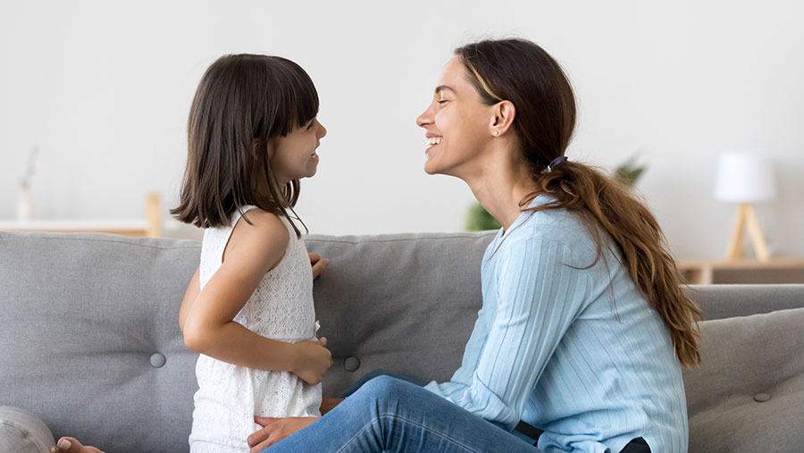 Mother and daughter looking at each other