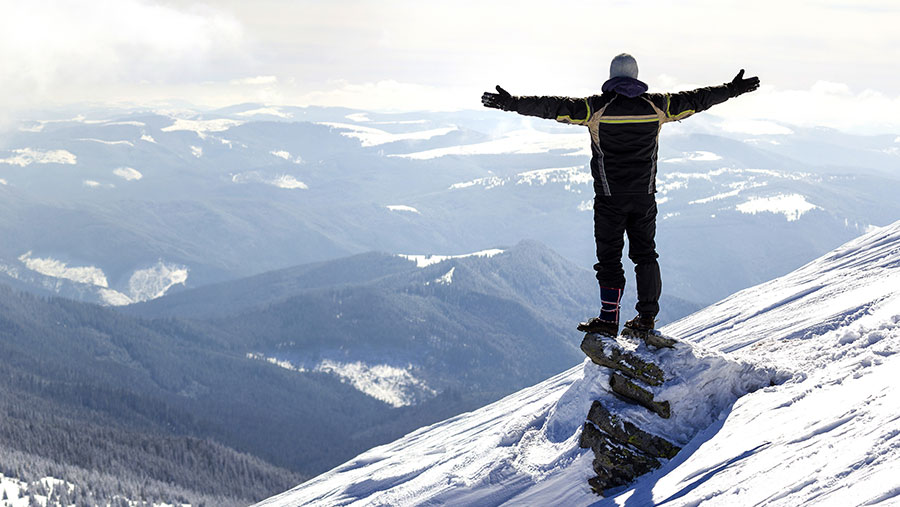 Man on top of mountain