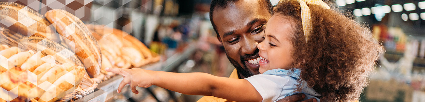 Father and daughter buying bread